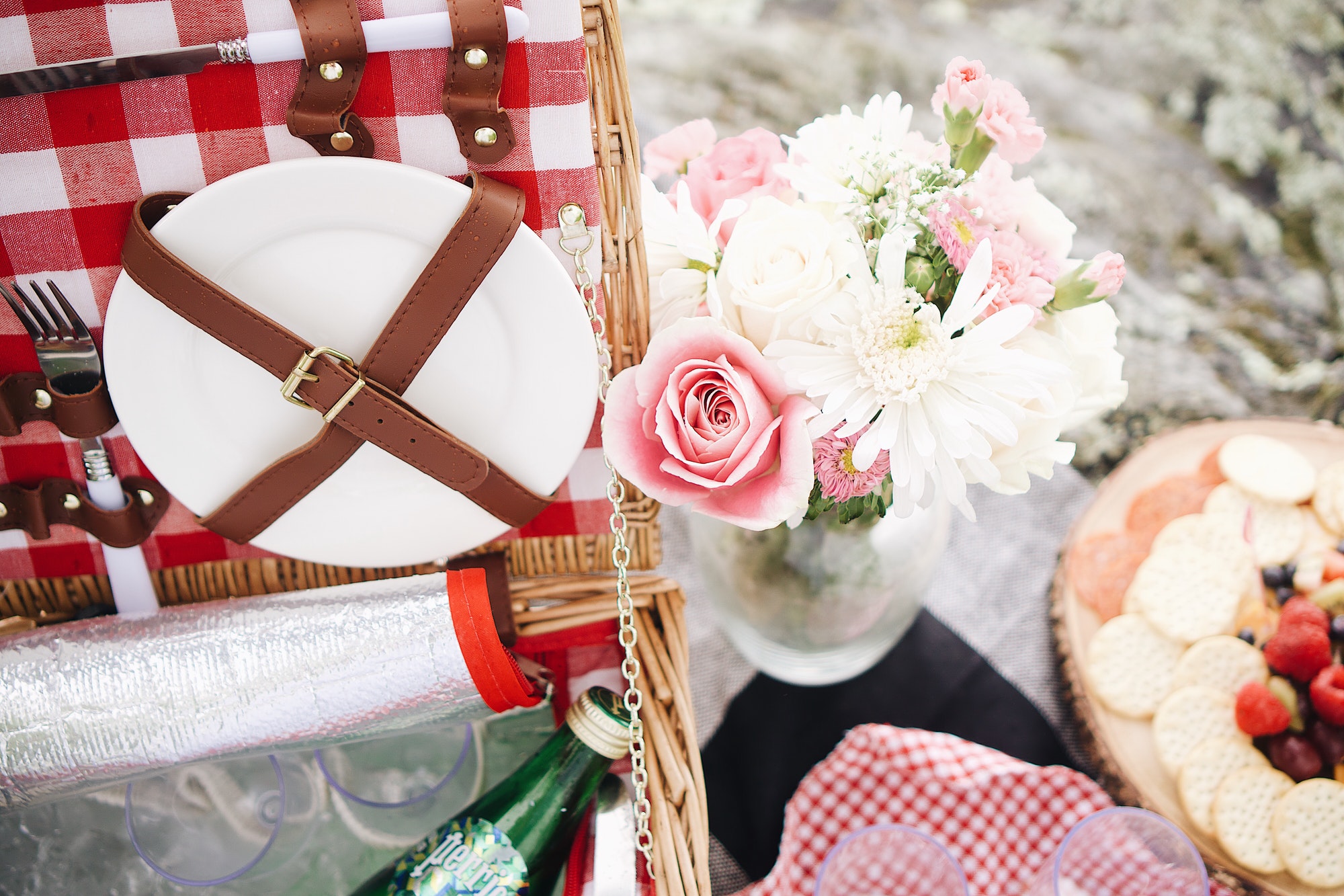 Romantic picnic with flowers and picnic basket